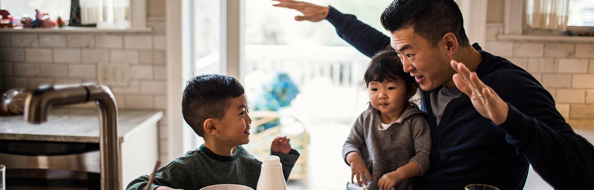 man with small children