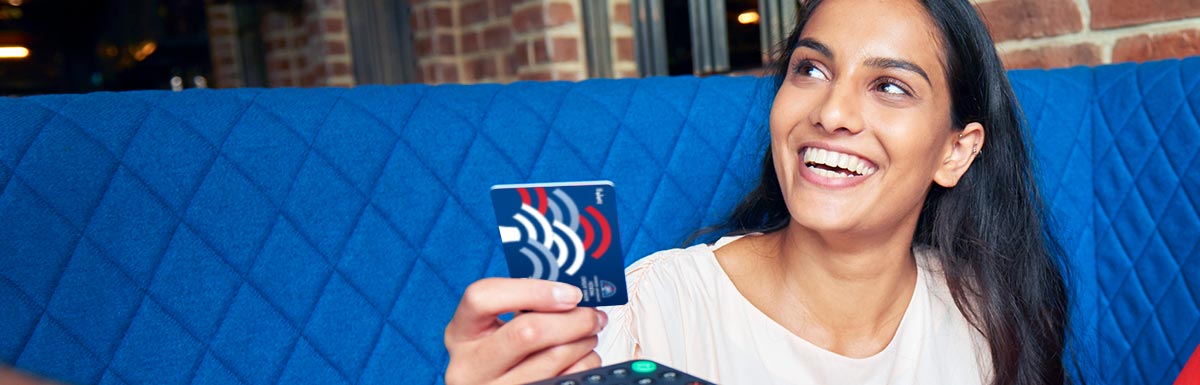 Smiling woman with Select Visa