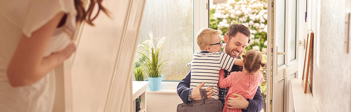 smiling man with kids