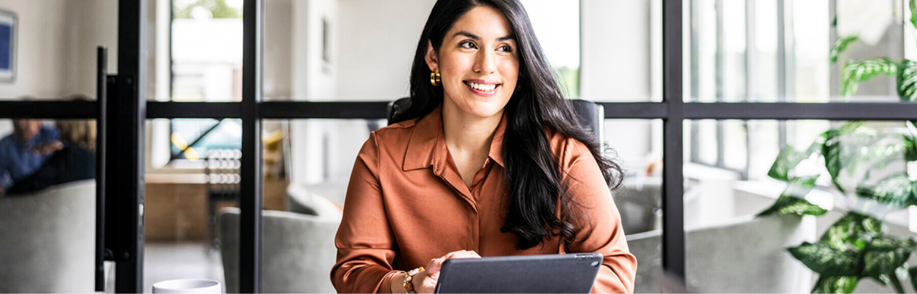 smiling woman using tablet
