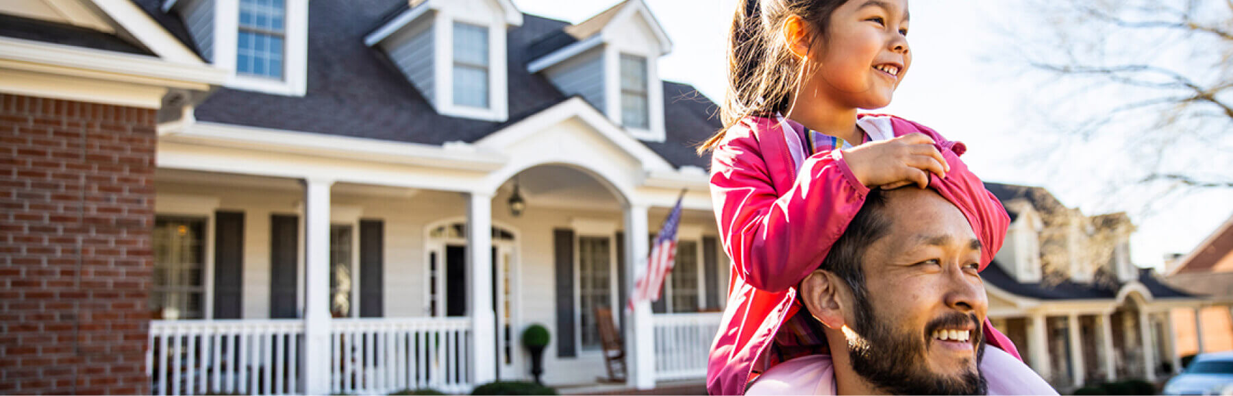 Man with daughter on shoulders