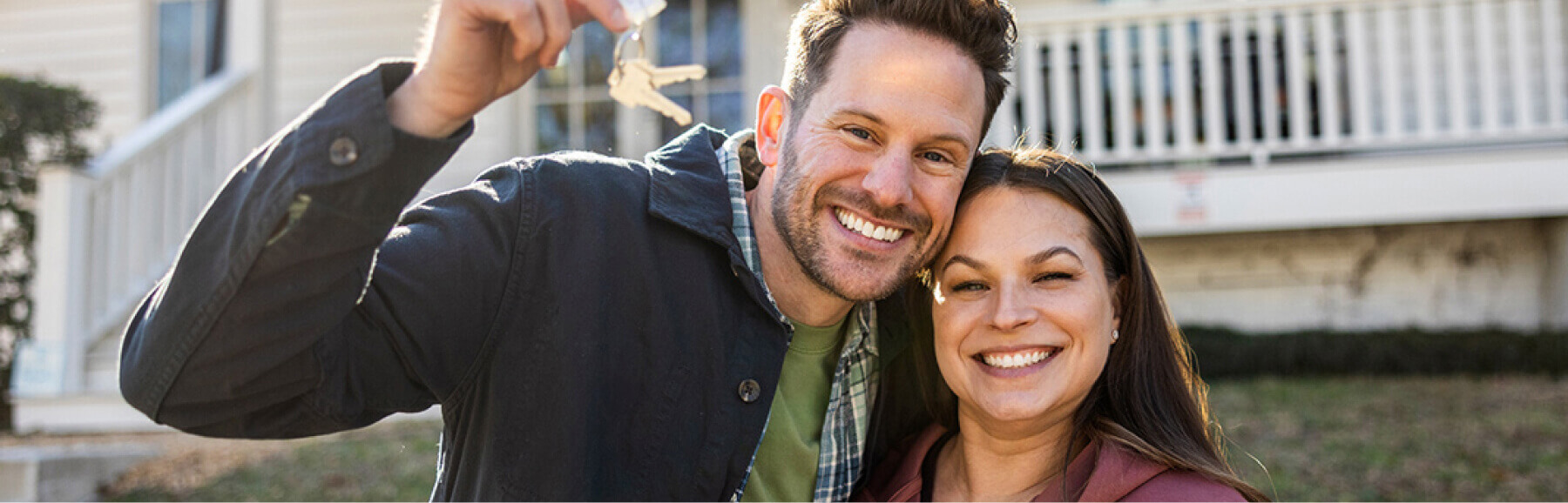 couple showing new home keys