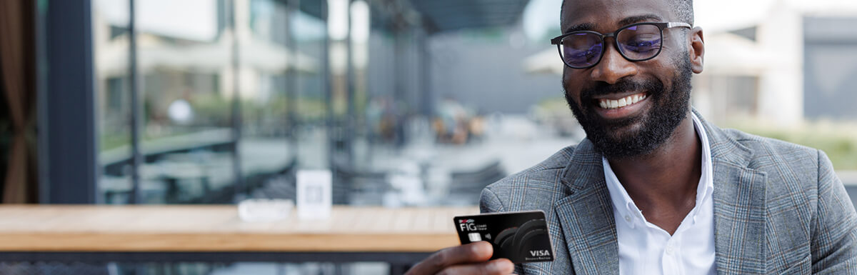 business man looking at credit card